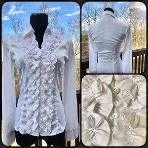 Blouse with flower detail and rhinestone buttons.